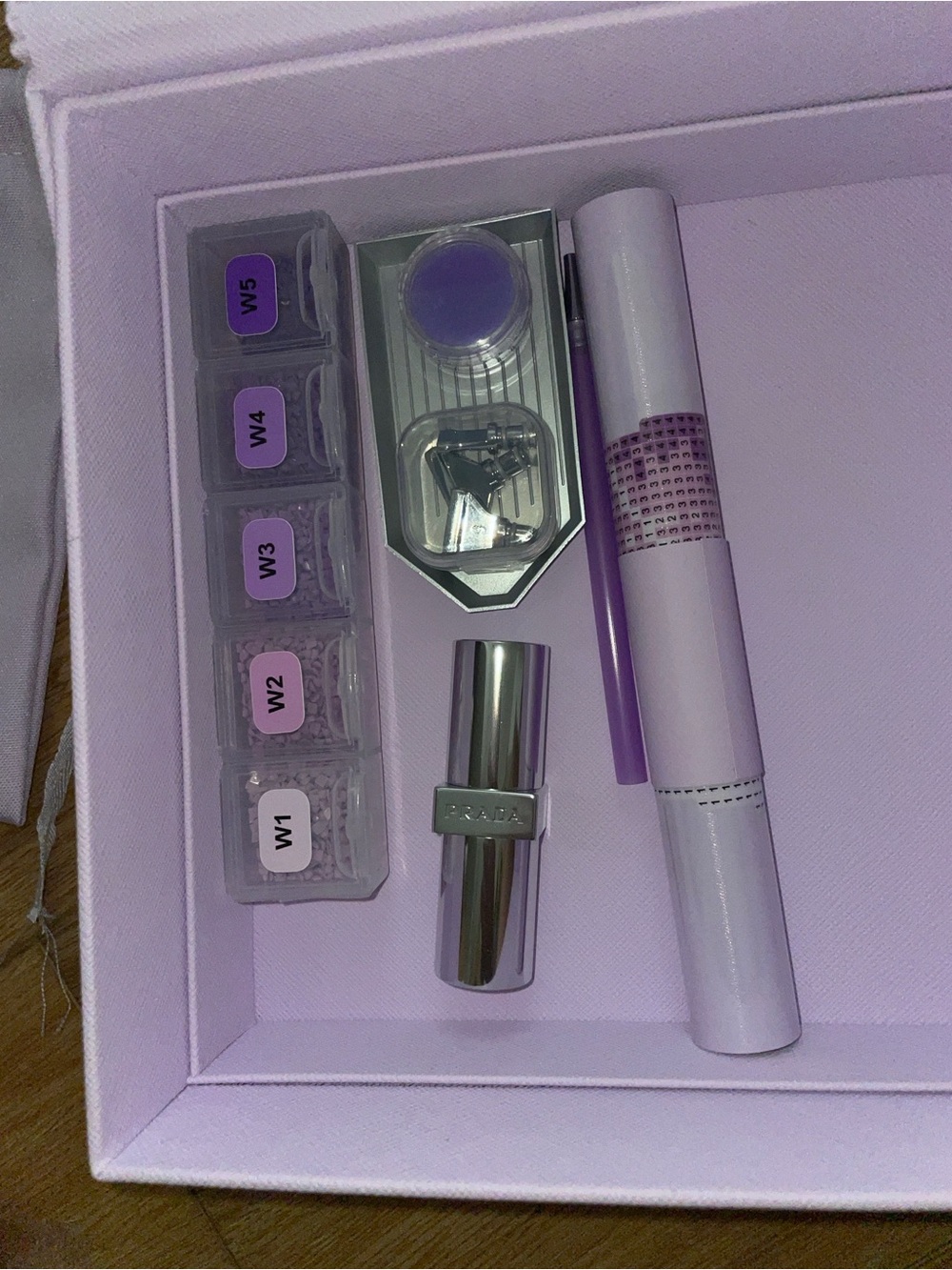 Prada lip stick and gem